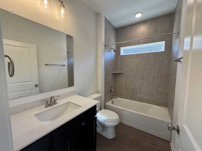 Furnished interior view inside a new home in Village at Three Oaks, Seguin (Image 7).
