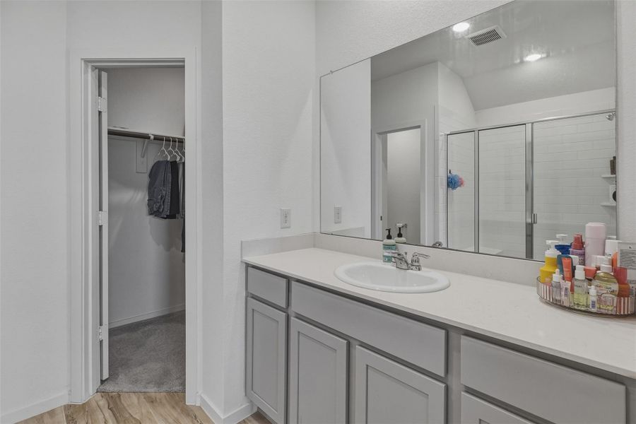 primary bathroom and the other his/her closet