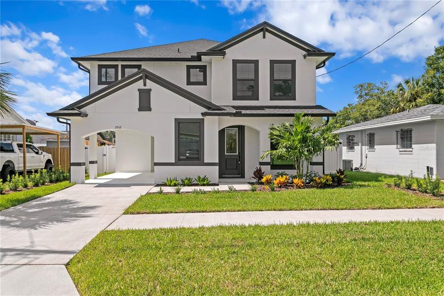 Front exterior of a new home in , Tampa, FL, highlighting curb appeal (Image 1). Front exterior of a new home in , Tampa, FL, highlighting curb appeal (Image 1).