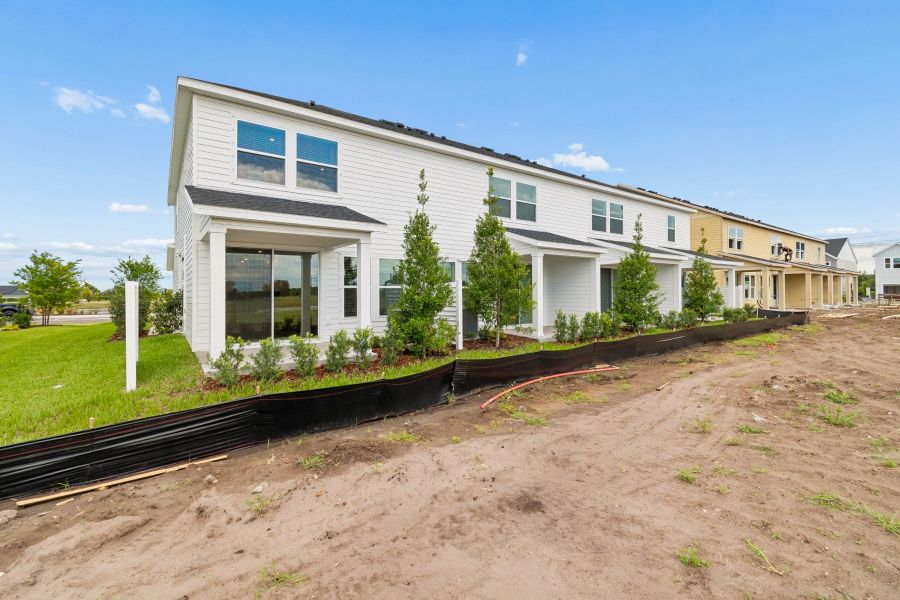 Exterior details and patio area of a home in Waterset Townhomes, Apollo Beach (Image 3).