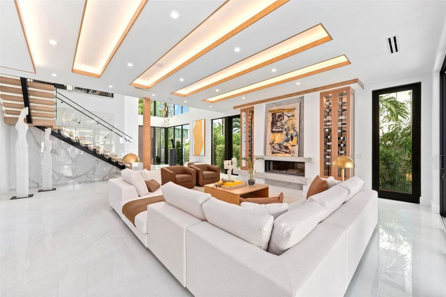 grand open space with soaring ceilings and breathtaking water views, A Fireplace, Custom Wine Storage,