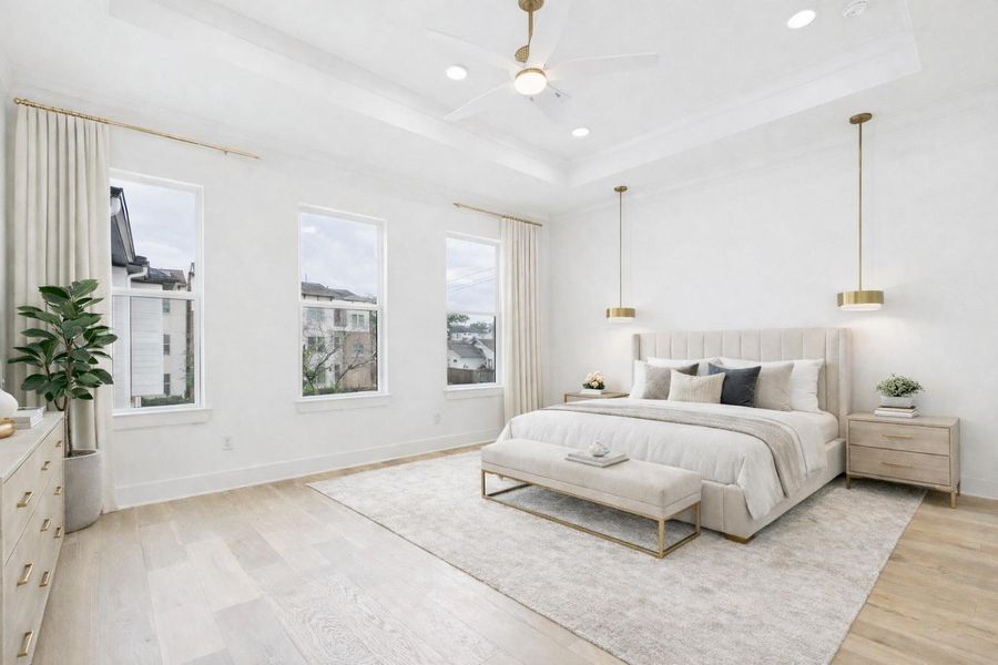 Bright, spacious primary bedroom room features three large windows, recessed lighting in the coffered ceiling with fan, and two modern pendant lights. Ideal for reading in bed. (Virtually staged)