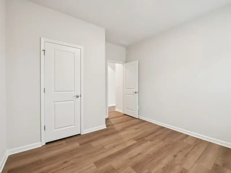 Spacious, unfurnished interior of a new home in Country Lane - Signature Series, Clayton (Image 12).