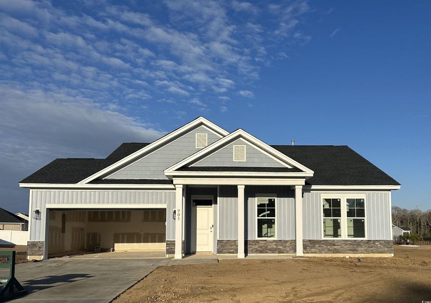 View of front of home featuring roof with shingles, a porch, a garage, and board and batten siding View of front of home featuring roof with shingles, a porch, a garage, and board and batten siding