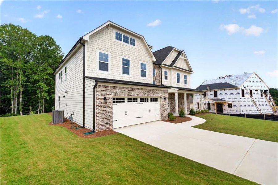 Front exterior of a new home in Arbor West, Dawsonville, GA, highlighting curb appeal (Image 2).