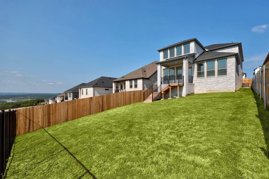Front exterior of a new home in Lakeside at Tessera, Lago Vista, TX, highlighting curb appeal (Image 1). Front exterior of a new home in Lakeside at Tessera, Lago Vista, TX, highlighting curb appeal (Image 1).