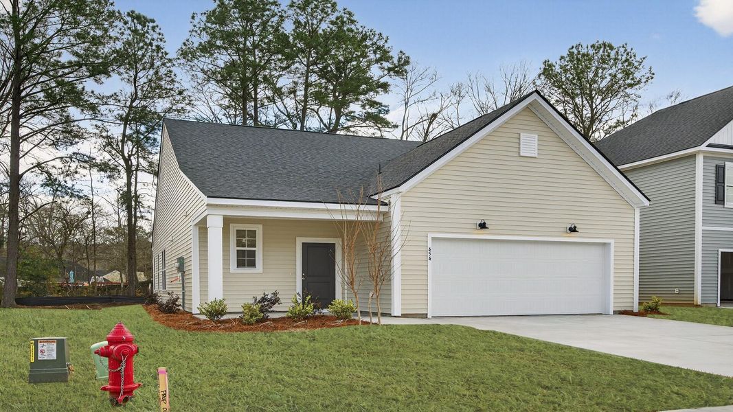Front exterior of a new home in Creekside at Andrews, Summerville, SC, highlighting curb appeal (Image 1). Front exterior of a new home in Creekside at Andrews, Summerville, SC, highlighting curb appeal (Image 1).