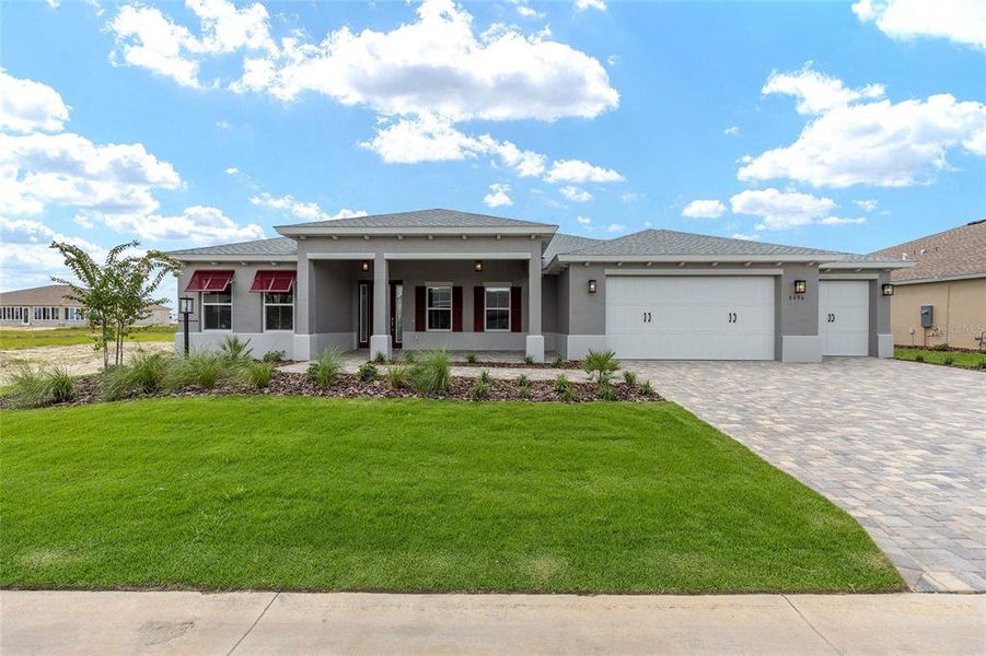 Front exterior of a new home in On Top of the World Communities, Ocala, FL, highlighting curb appeal (Image 20).