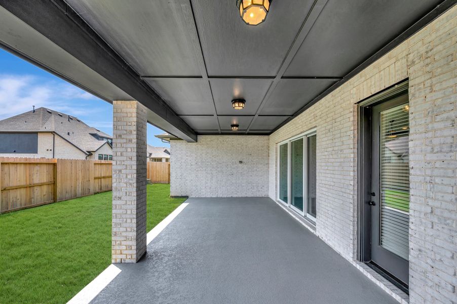 Exterior details and patio area of a home in Riceland - Summit Collection, Mont Belvieu (Image 4).