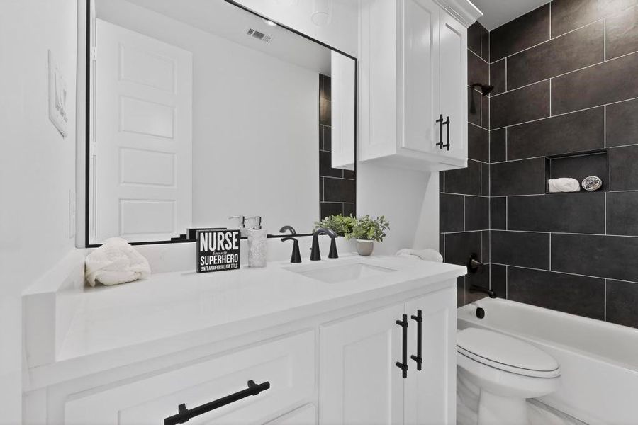 Bathroom with vanity and washtub / shower combination Bathroom with vanity and washtub / shower combination