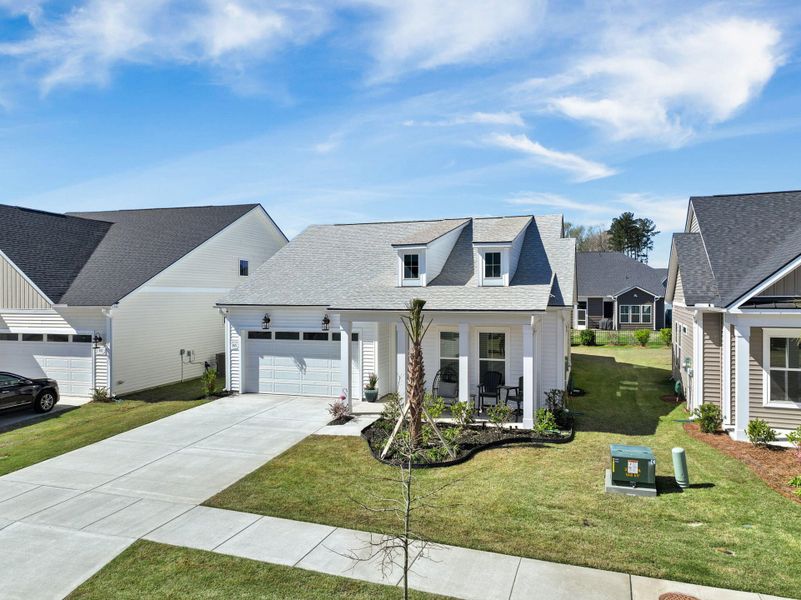Front exterior of a new home in Summerwind Crossing at Lakes of Cane Bay, Summerville, SC, highlighting curb appeal (Image 27).