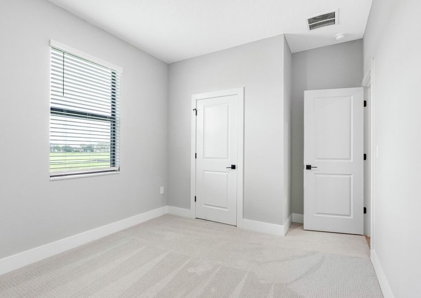 Each secondary bedroom includes carpet, a closet and bright open windows