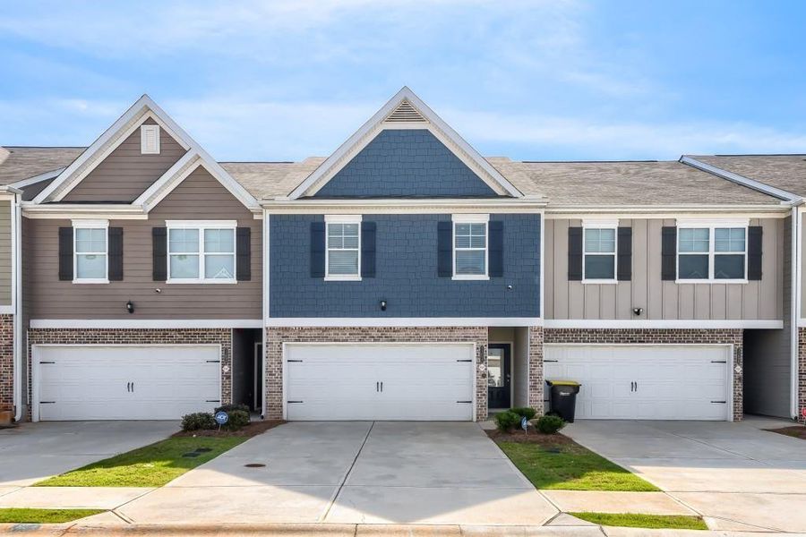 Front exterior of a new home in , Hampton, GA, highlighting curb appeal (Image 1). Front exterior of a new home in , Hampton, GA, highlighting curb appeal (Image 1).