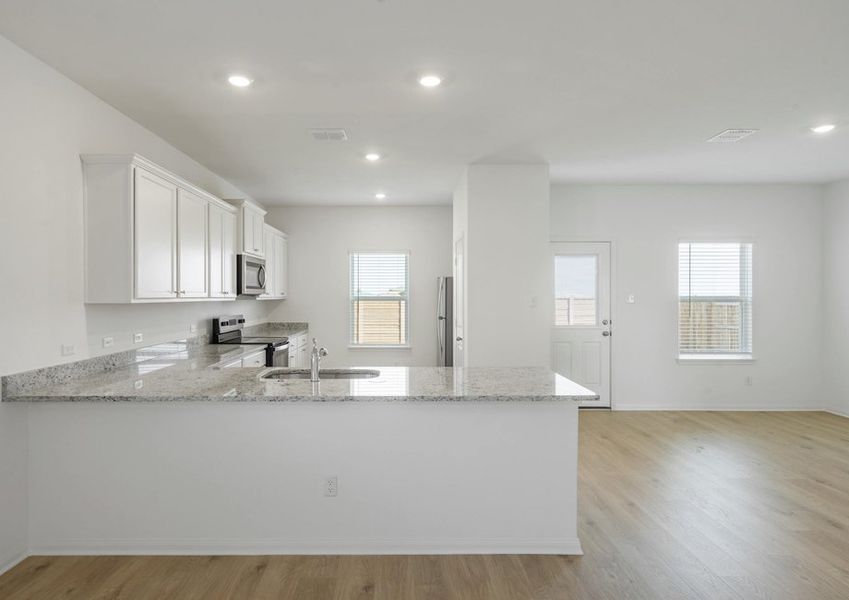 Kitchen and adjoing dining room with plenty of natural light