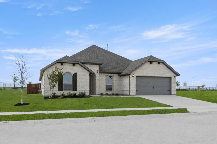 Front exterior of a new home in Timberbrook, Justin, TX, highlighting curb appeal (Image 2). Front exterior of a new home in Timberbrook, Justin, TX, highlighting curb appeal (Image 2).