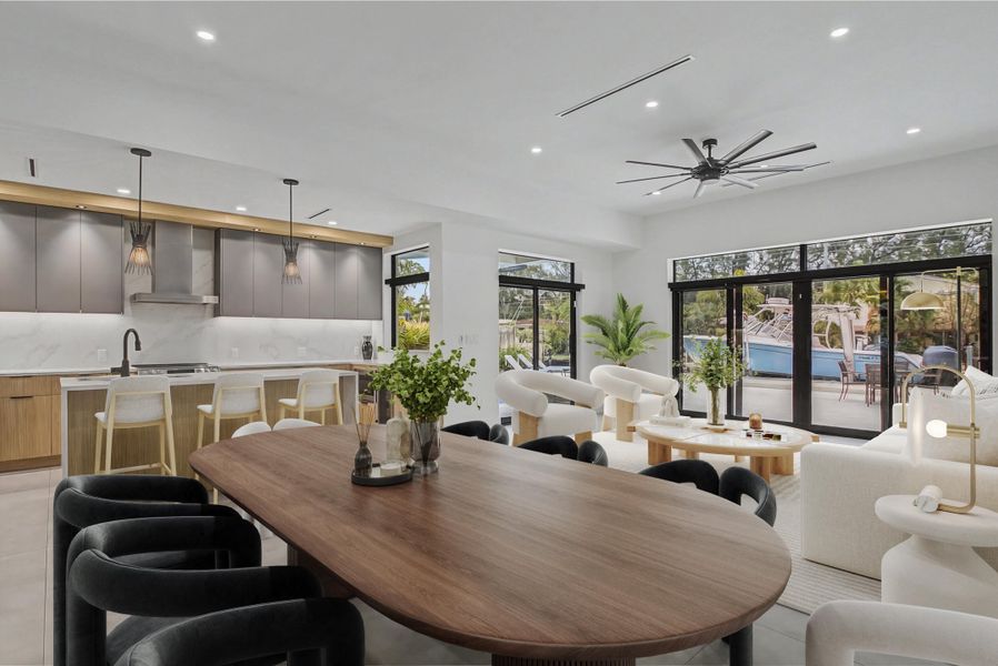 Virtually staged dining and living area.