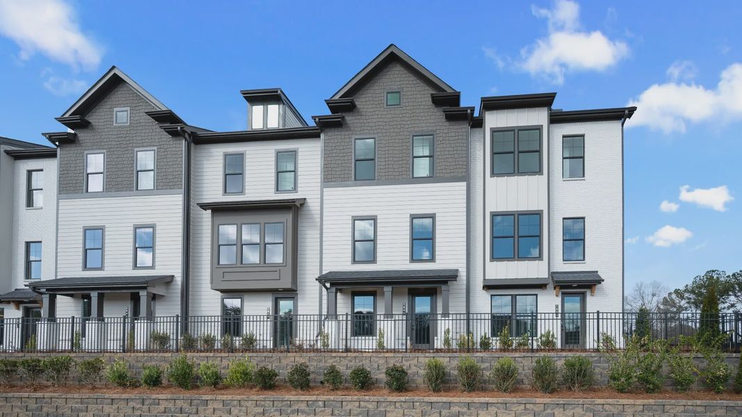 Front exterior of a new home in Barrett Pointe, Kennesaw, GA, highlighting curb appeal (Image 2). Front exterior of a new home in Barrett Pointe, Kennesaw, GA, highlighting curb appeal (Image 2).