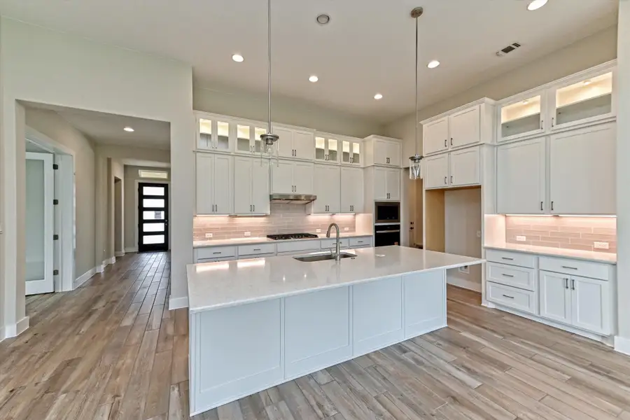 Representative furnished interior of a home built from the Opal by Giddens Homes in Riverstone, Georgetown (Image 5).