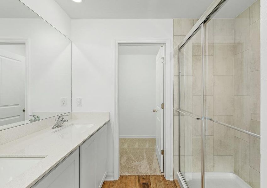 Get ready for the day in the master bathroom that comes equipped with a walk-in shower and double sink counter Get ready for the day in the master bathroom that comes equipped with a walk-in shower and double sink counter