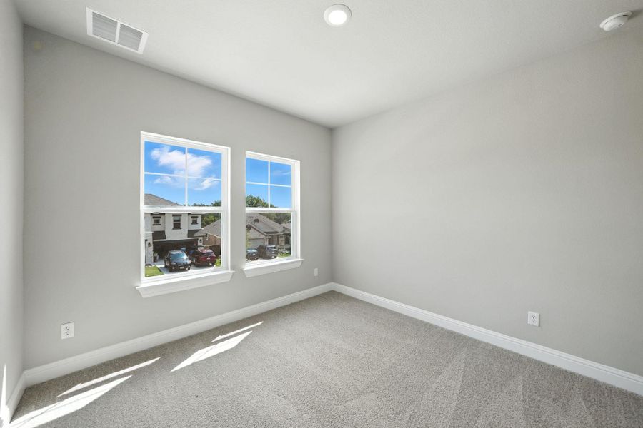 Carpeted spare room featuring baseboards and recessed lighting Carpeted spare room featuring baseboards and recessed lighting