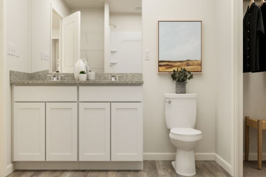 A bathroom with a toilet and sink.
