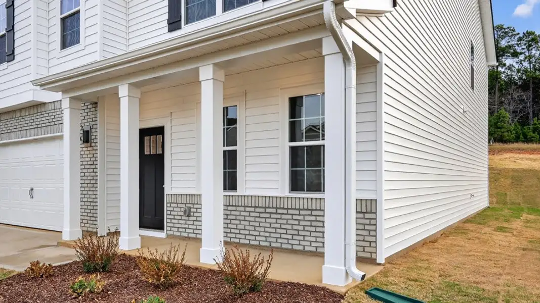 Exterior details and patio area of a home in Olive Branch, Wilson's Mills (Image 3).