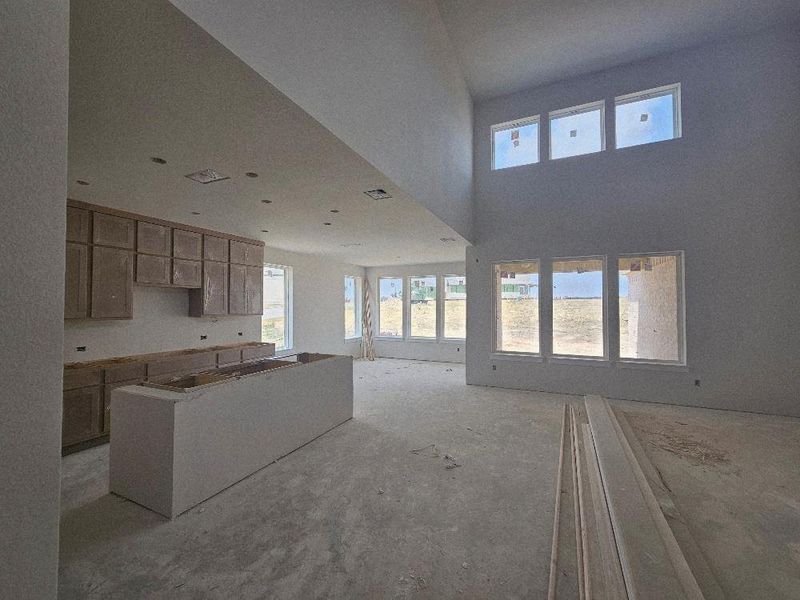 Kitchen with healthy amount of natural light, open floor plan, and a towering ceiling Kitchen with healthy amount of natural light, open floor plan, and a towering ceiling