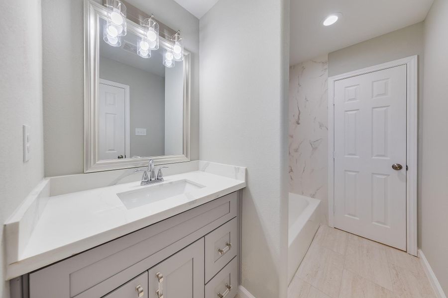 Experience true comfort in this primary bath, offering plenty of space to prepare for your day with ease.