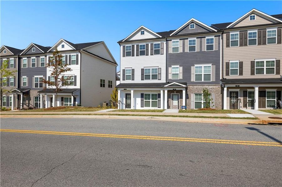 Front exterior of a new home in Nickel Creek at Newnan Crossing, Newnan, GA, highlighting curb appeal (Image 23). Front exterior of a new home in Nickel Creek at Newnan Crossing, Newnan, GA, highlighting curb appeal (Image 23).