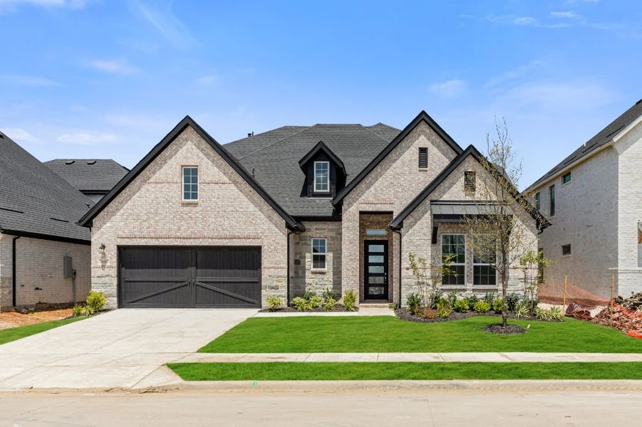 Representative exterior photo of a completed home built from the Grayson by UnionMain Homes in Cambridge Crossing, Celina, TX (Image 28).