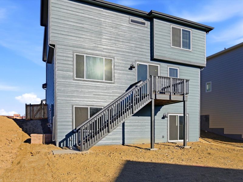 Exterior details and patio area of a home in Buffalo Highlands: The Flora Collection, Commerce City (Image 3).