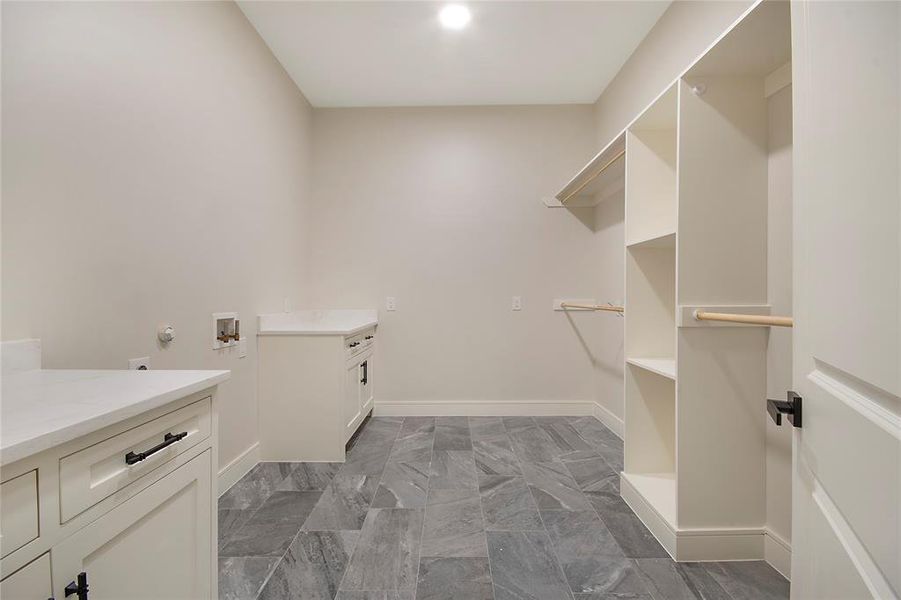 Laundry room with cabinet space and washer hookup