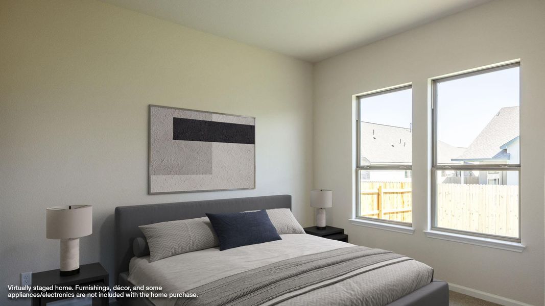 Carpeted bedroom with baseboards