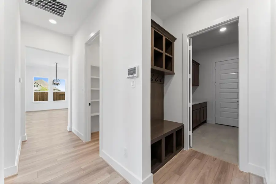 Built-in Organizer Bench with Hooks and Cubbies