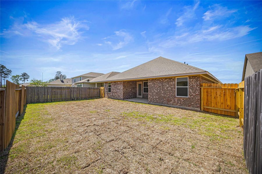 Front exterior of a new home in Grand Oaks Reserve, Cleveland, TX, highlighting curb appeal (Image 13). Front exterior of a new home in Grand Oaks Reserve, Cleveland, TX, highlighting curb appeal (Image 13).