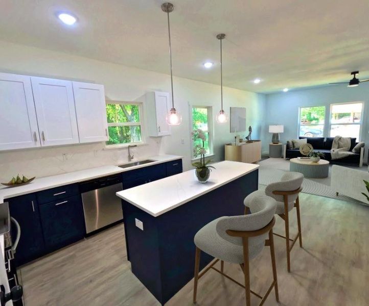 Kitchen featuring blue cabinetry, white cabinets, pendant lighting, backsplash, and recessed lighting Kitchen featuring blue cabinetry, white cabinets, pendant lighting, backsplash, and recessed lighting