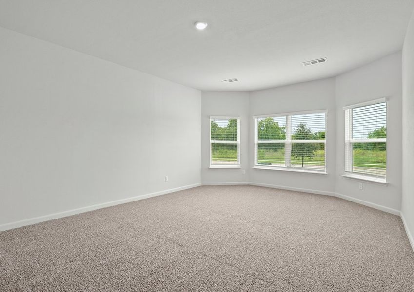 The master bedroom has large windows. The master bedroom has large windows.