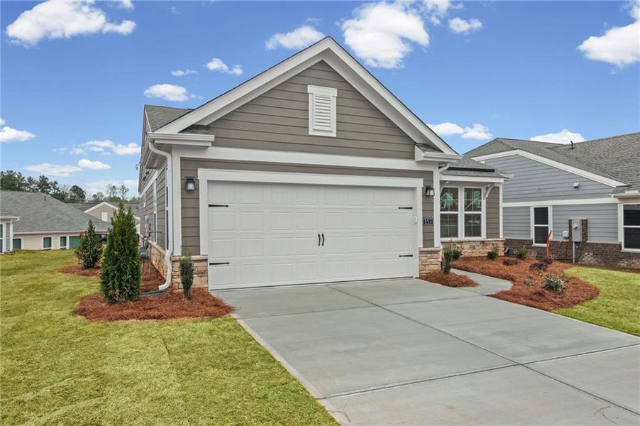 Front exterior of a new home in Laurel Farms, Dallas, GA, highlighting curb appeal (Image 23).