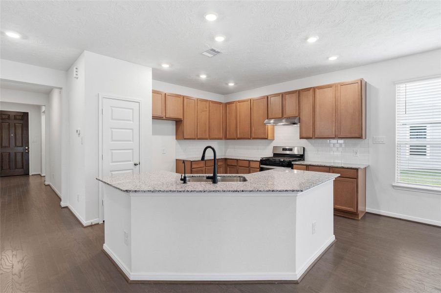 This spacious kitchen has it all—ample storage, generous counter space, and a layout that truly makes it the heart of the home. This spacious kitchen has it all—ample storage, generous counter space, and a layout that truly makes it the heart of the home.