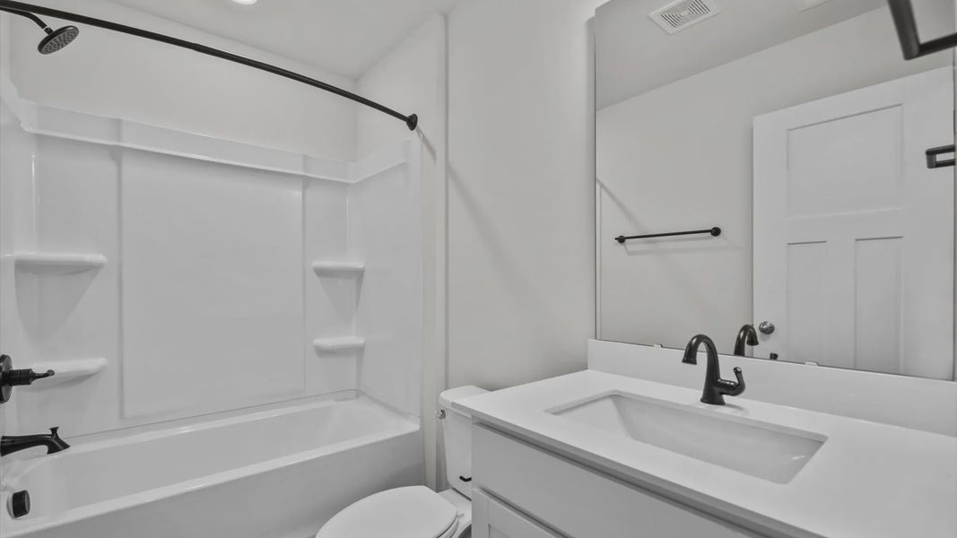 Representative furnished interior of a home built from the Jasmine by DRB Homes in Pleasant Falls, Moore (Image 10).