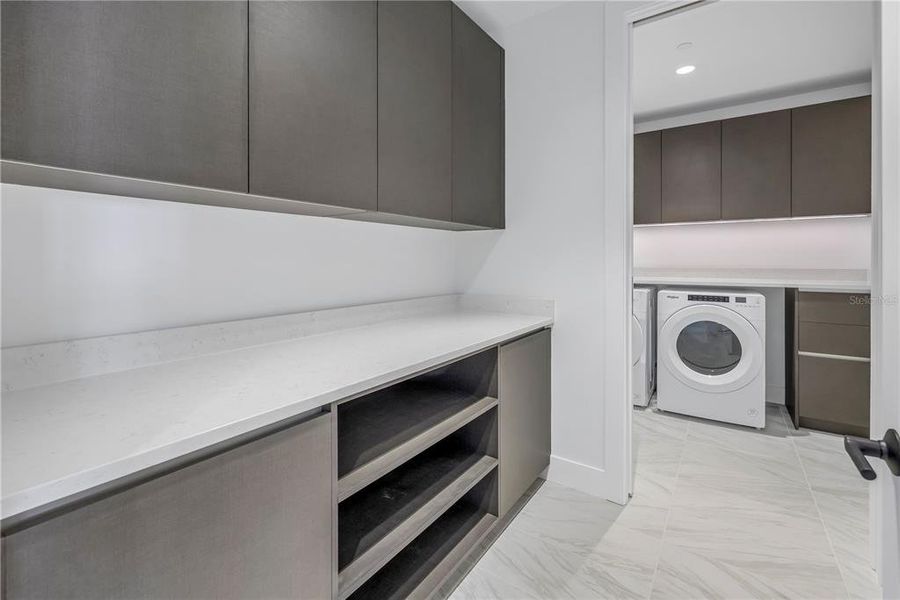 Convenient laundry room and additional storage