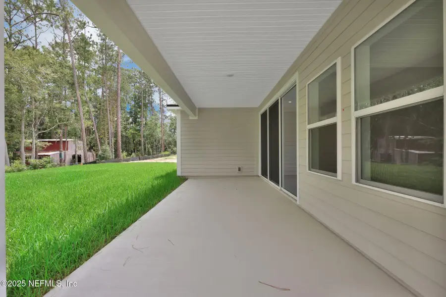Exterior details and patio area of a home in Creighton Pointe, Fleming Island (Image 4). Exterior details and patio area of a home in Creighton Pointe, Fleming Island (Image 4).