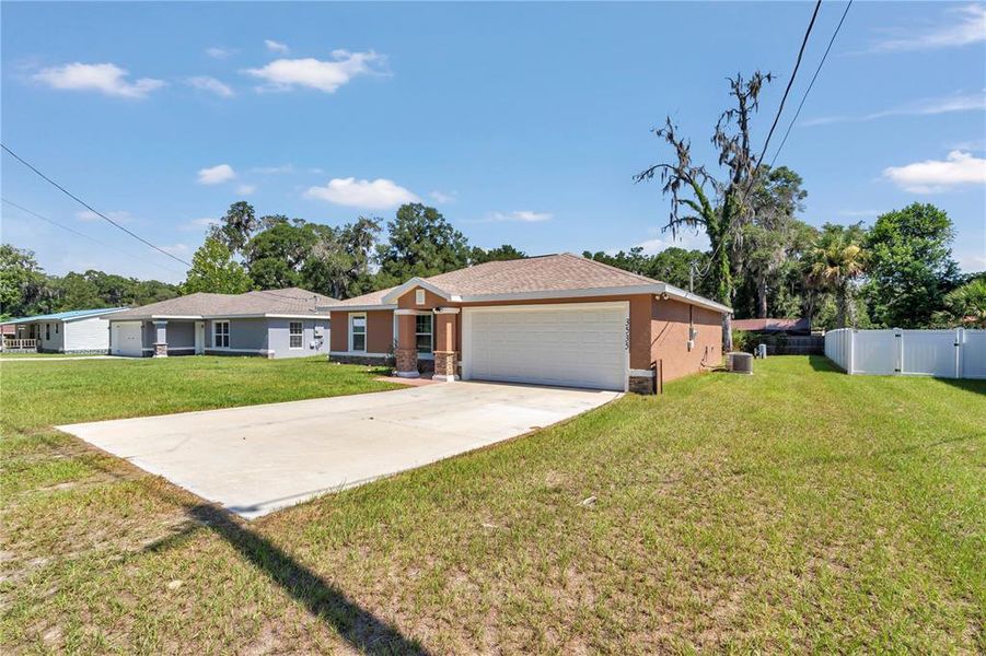 Front exterior of a new home in , Belleview, FL, highlighting curb appeal (Image 2). Front exterior of a new home in , Belleview, FL, highlighting curb appeal (Image 2).