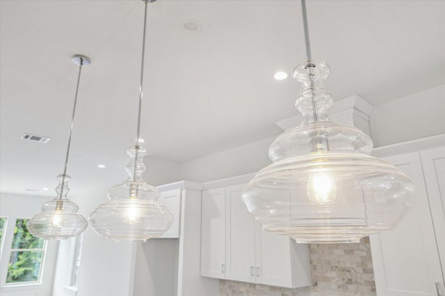 Modern Pendant Lighting Above the Marble Island. Modern Pendant Lighting Above the Marble Island.