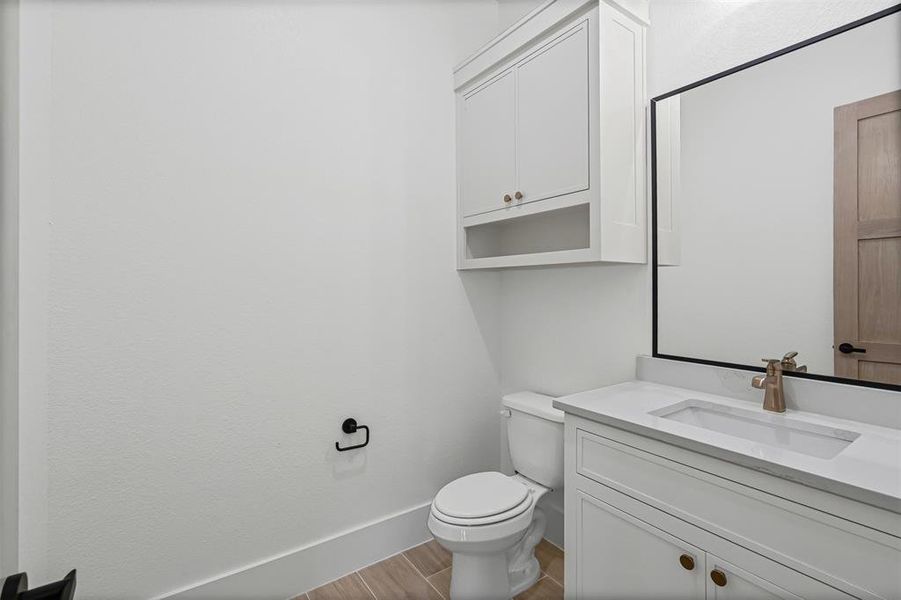 Bathroom featuring vanity and light wood-style flooring Bathroom featuring vanity and light wood-style flooring