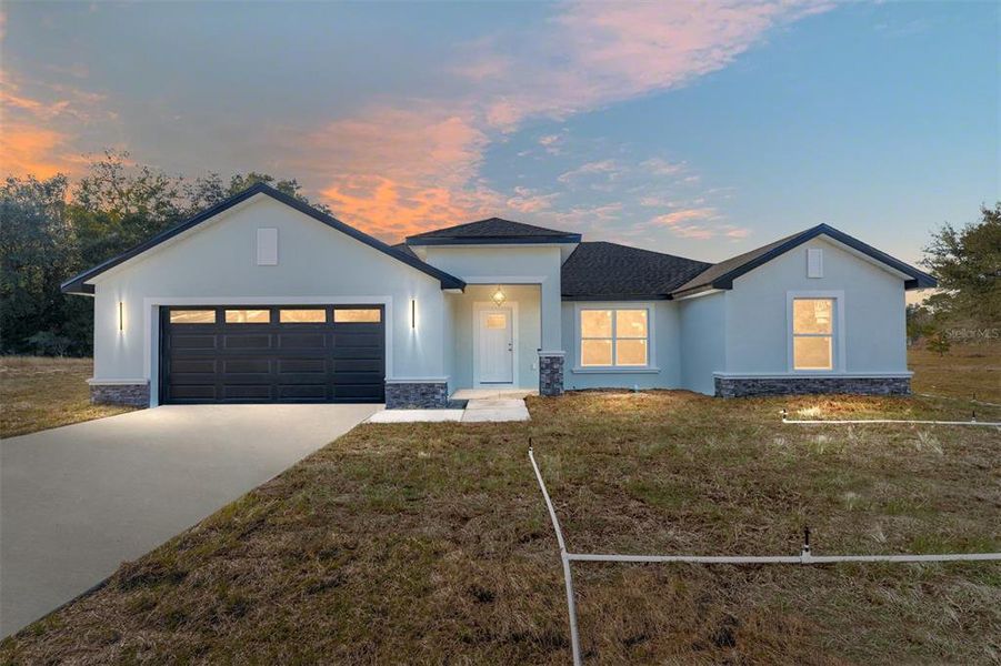 Front exterior of a new home in , Dunnellon, FL, highlighting curb appeal (Image 26).