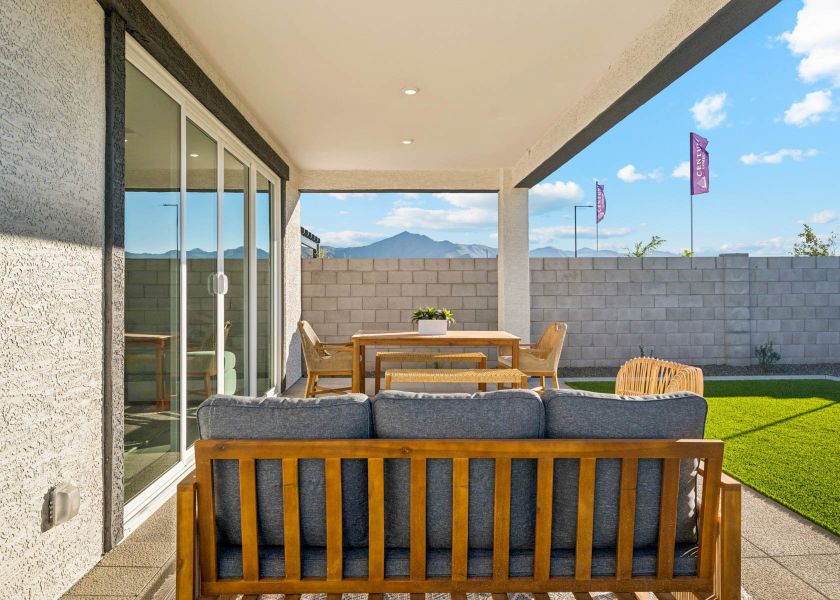 A patio with a table and chairs. A patio with a table and chairs.