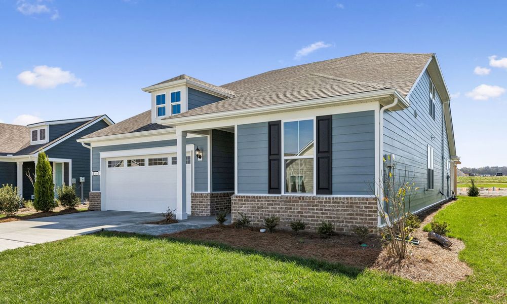 Front exterior of a new home in Del Webb Southern Harmony, Murfreesboro, TN, highlighting curb appeal (Image 23).