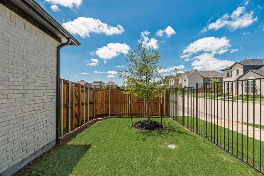 Fenced backyard featuring a residential view Fenced backyard featuring a residential view