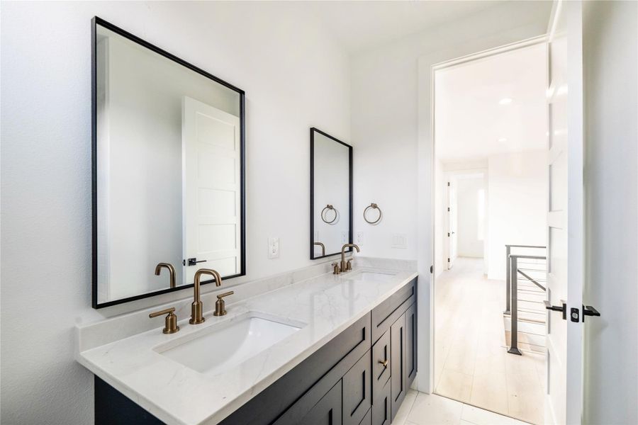 Bathroom featuring double vanity